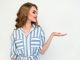 Woman in Blue and White Striped Top Raising Her Left Hand